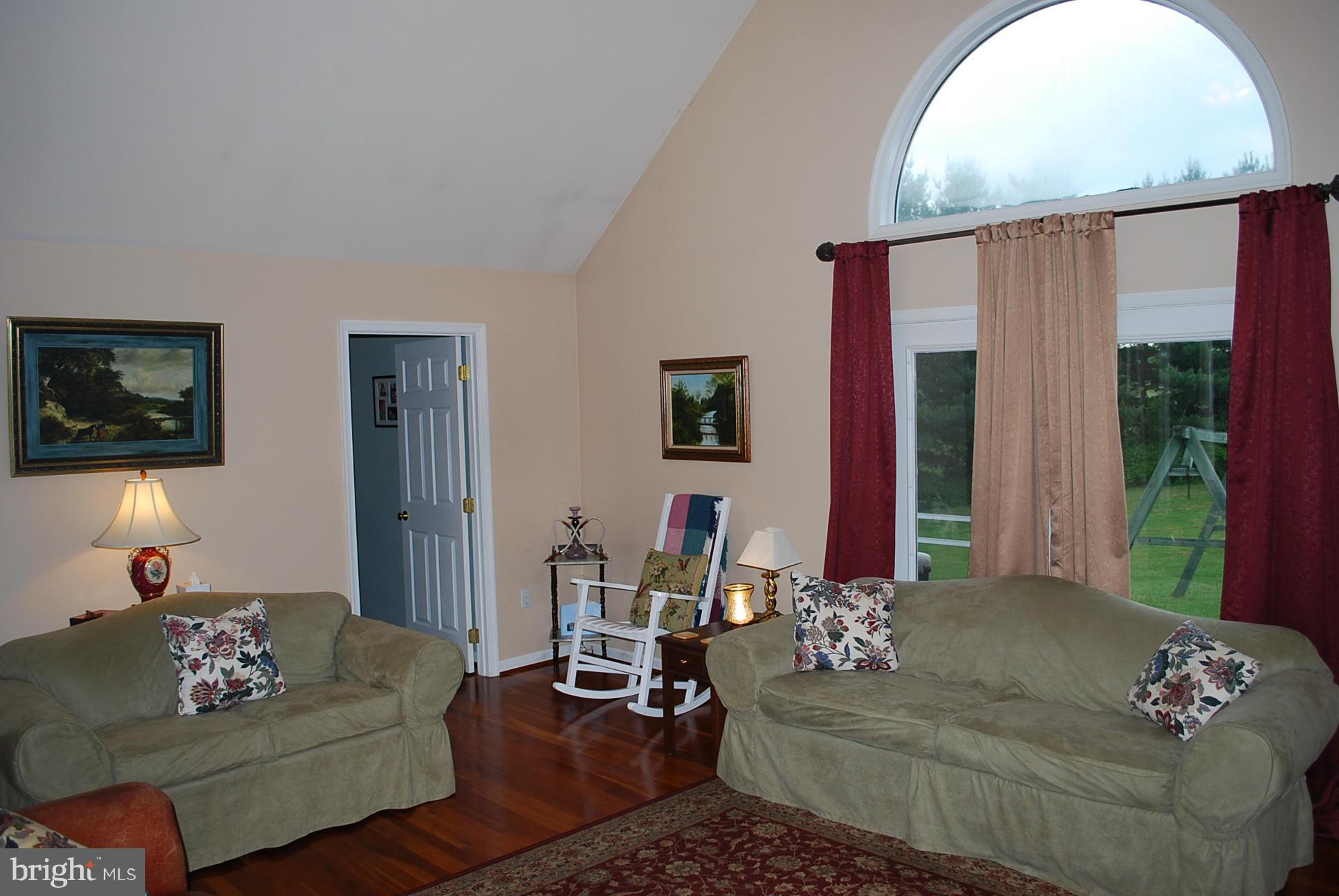 82 Resettlement Road Huntly, VA 22640 - Photo 6 of 21 a living room with furniture and a large window