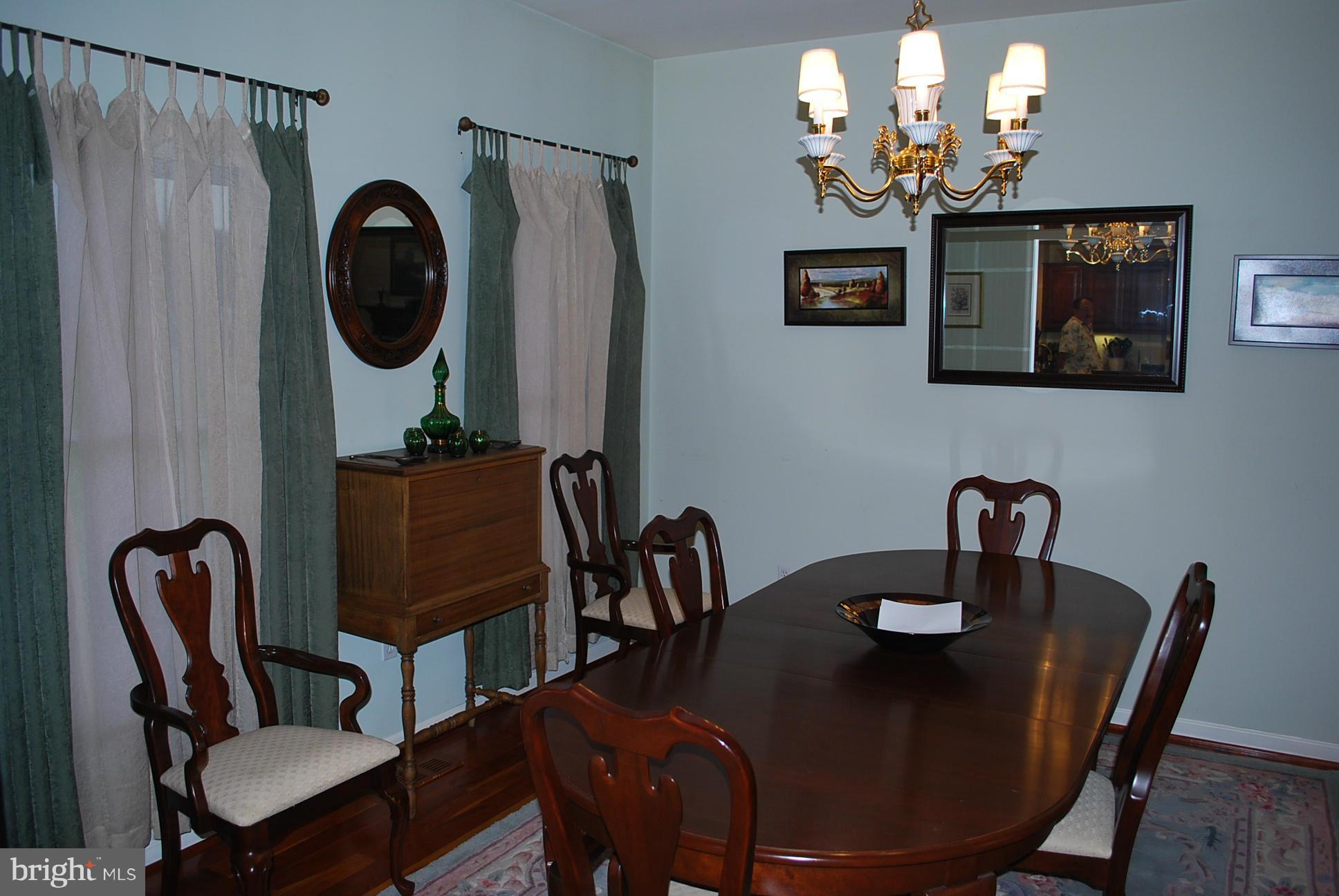 82 Resettlement Road Huntly, VA 22640 - Photo 7 of 21 a view of a dining room with furniture and chandelier