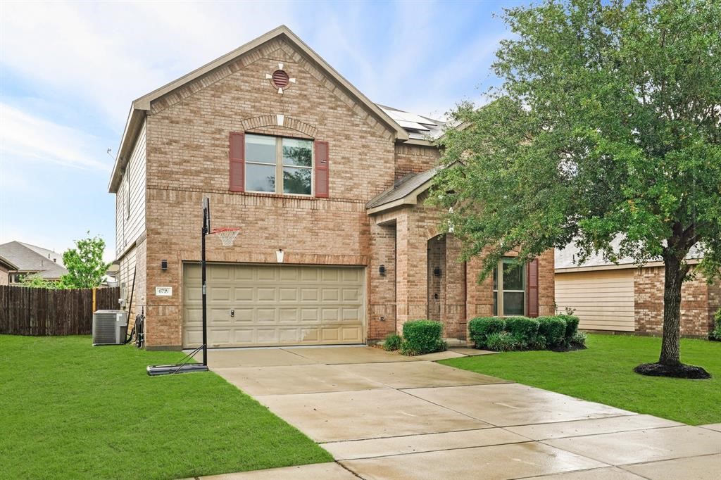 6719 Path Way Court Katy, TX 77449 - Photo 3 of 35 a front view of a house with a garden and plants