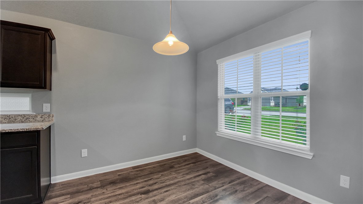 2106 Stubbs Drive Bryan, TX 77807 - Photo 3 of 11 a view of an empty room with a window and wooden floor