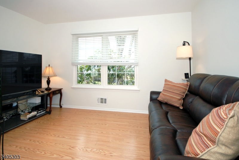 10 Apache Way Somerville, NJ 08876 - Photo 17 of 37 a living room with furniture and a flat screen tv