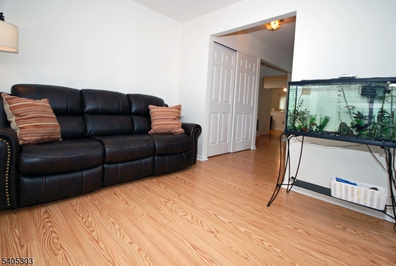 10 Apache Way Somerville, NJ 08876 - Photo 18 of 37 a living room with a couch and a wooden floor