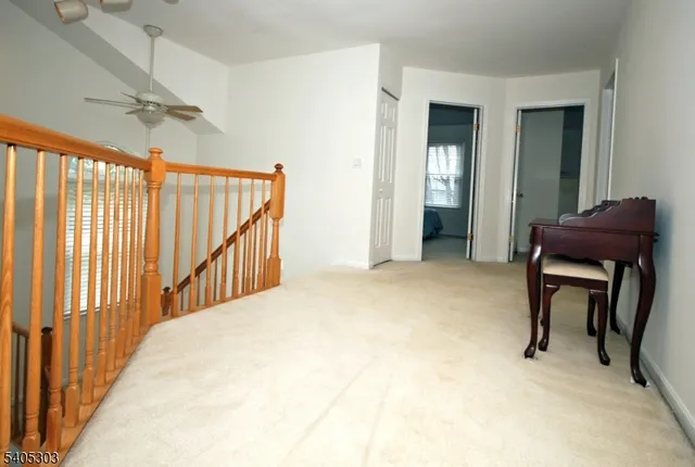 a view of a hallway with seating area