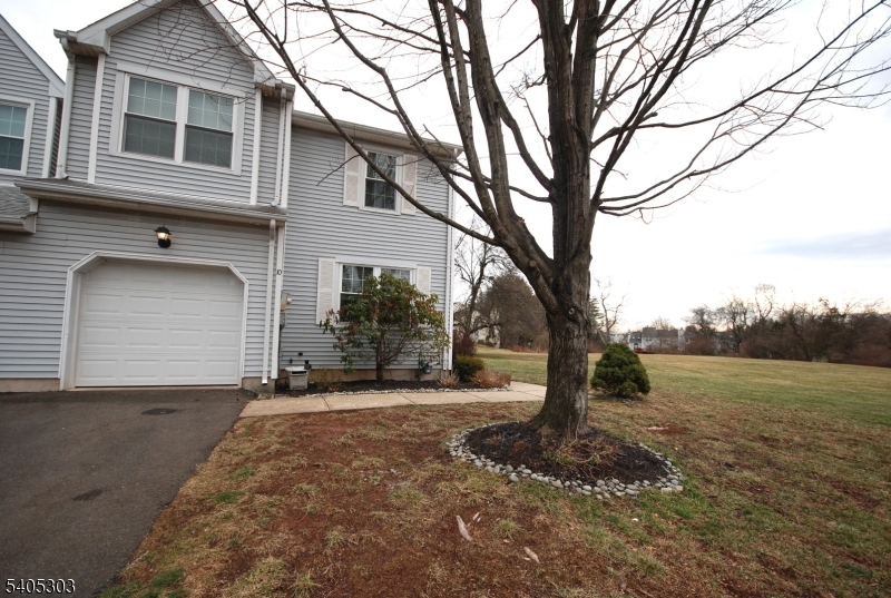 10 Apache Way Somerville, NJ 08876 - Photo 2 of 37 a front view of a house with a yard and garage
