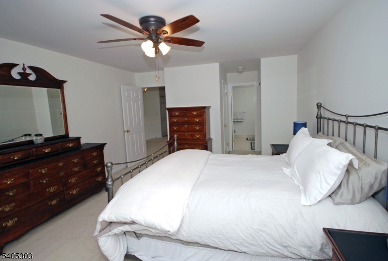 10 Apache Way Somerville, NJ 08876 - Photo 23 of 37 a bedroom with a bed and a dresser