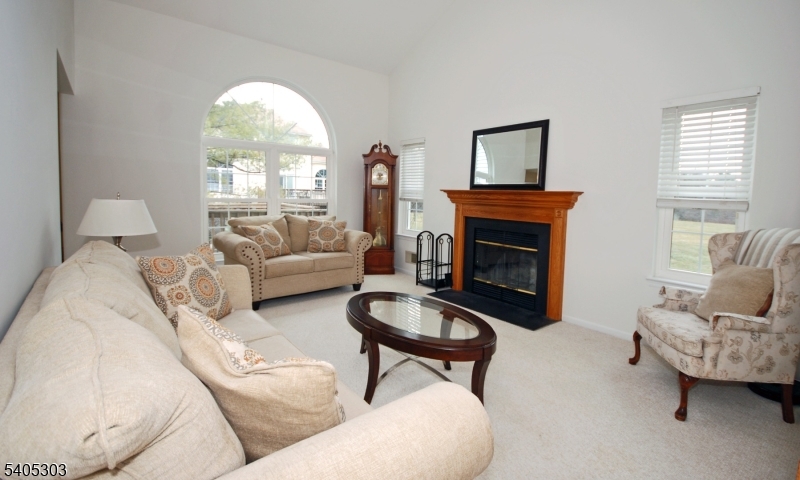 10 Apache Way Somerville, NJ 08876 - Photo 7 of 37 a living room with furniture a fireplace and a large window