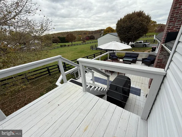 a bedroom with bed and a flat tv screen