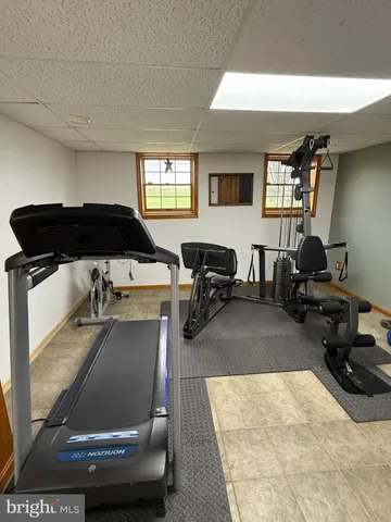 a big yard with lots of green space and mountain view in back