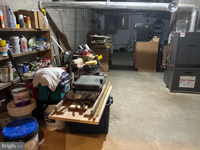 a front view of a house with a yard table and chairs