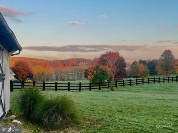 a view of a swimming pool with an outdoor space and seating area