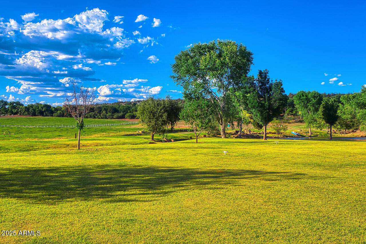 a view of a swimming pool with an outdoor space and seating area