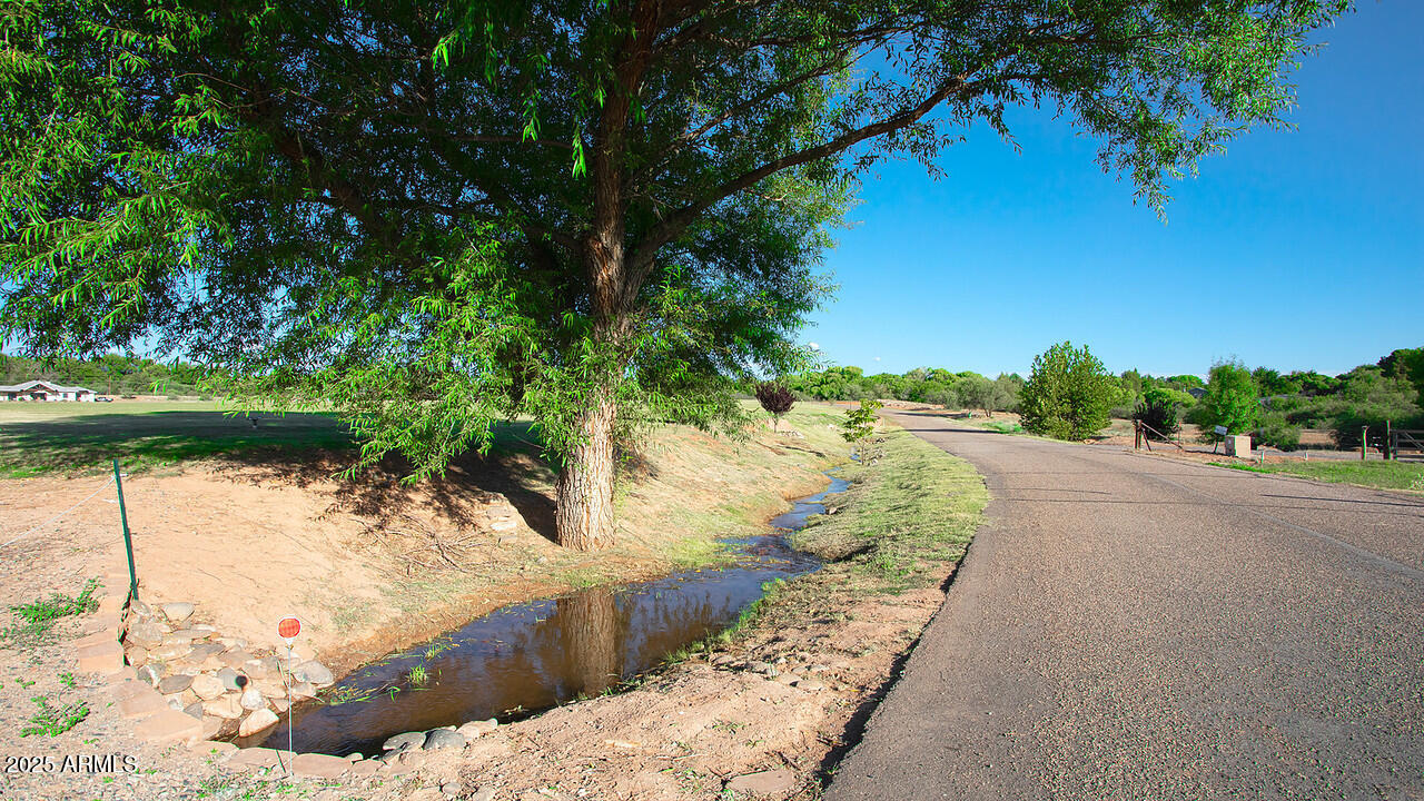 275 South Bonito Ranch Loop, Unit 25 Cornville, AZ 86325 - Photo 13 of 27 a view of a road with a yard