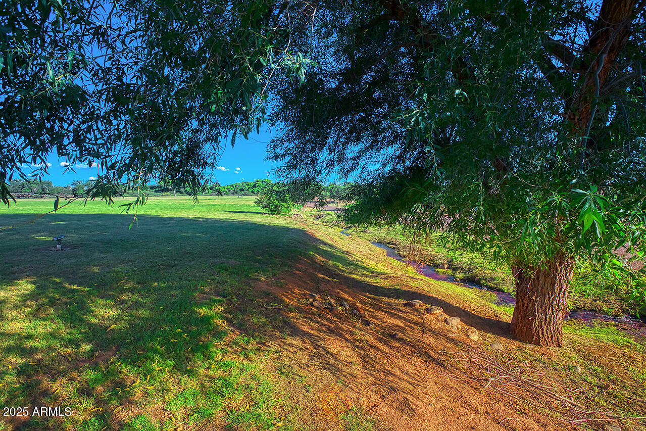 275 South Bonito Ranch Loop, Unit 25 Cornville, AZ 86325 - Photo 2 of 27 a view of a yard with an trees