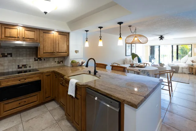 a large bed sitting in a bedroom next to a window