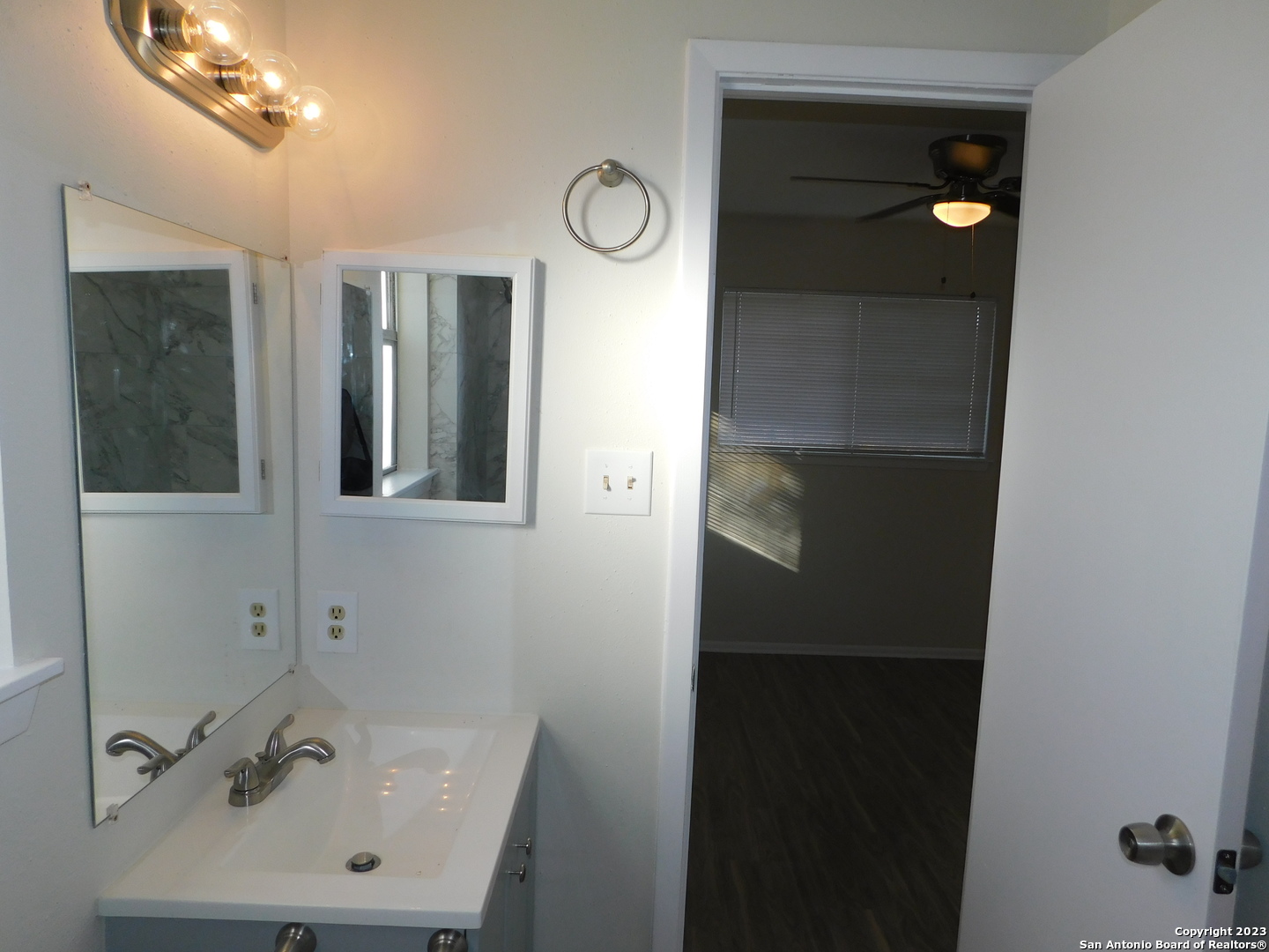 923 Spring Park Drive San Antonio, TX 78227 - Photo 27 of 30 a bathroom with a sink and mirror