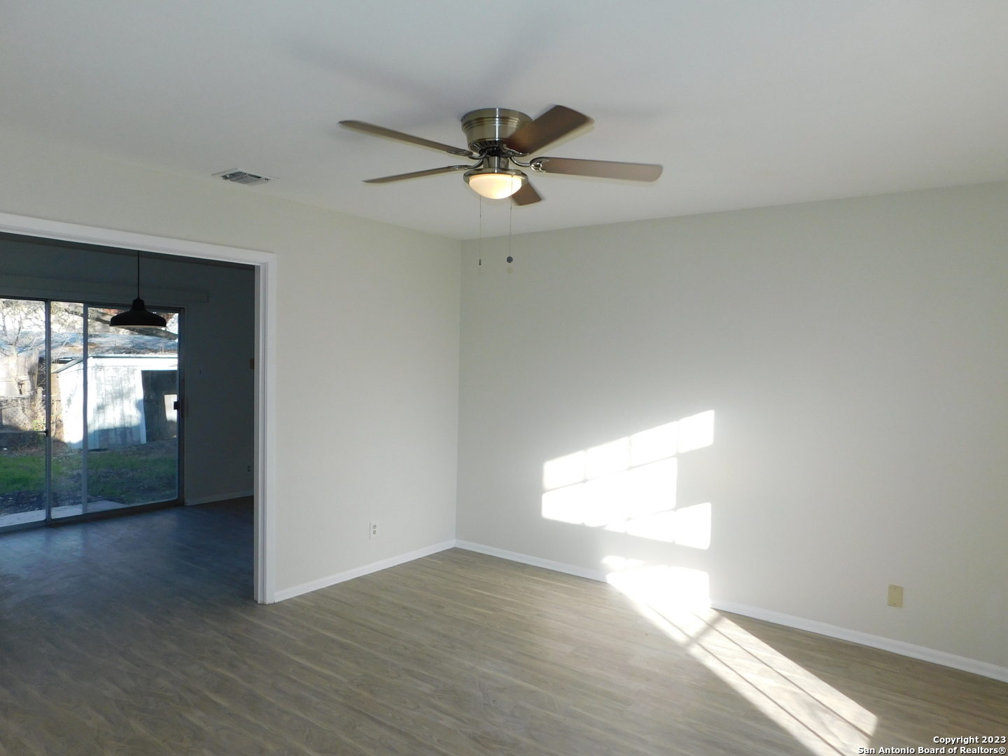 923 Spring Park Drive San Antonio, TX 78227 - Photo 4 of 30 a view of empty room with wooden floor