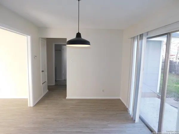 a view of an empty room and window