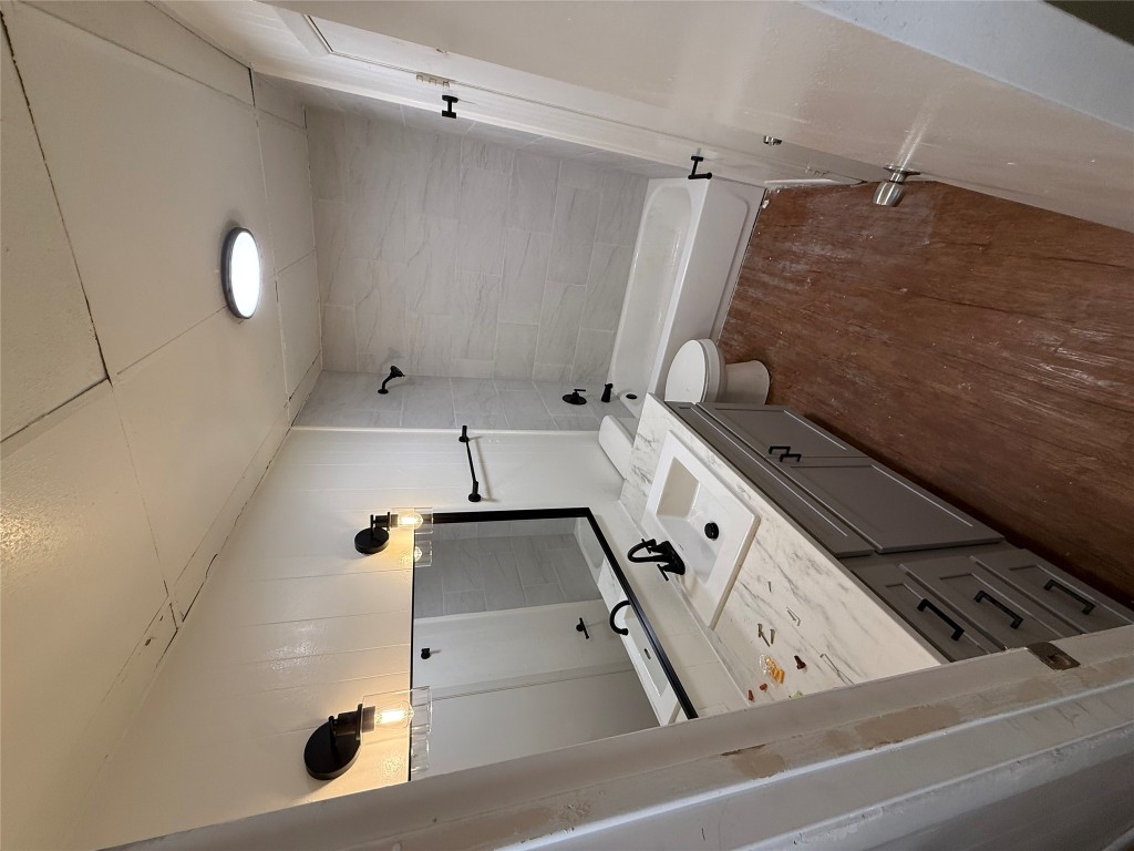 2103 Dixie Lane Round Rock, TX 78664 - Photo 2 of 8 a bathroom with a sink a toilet and shower