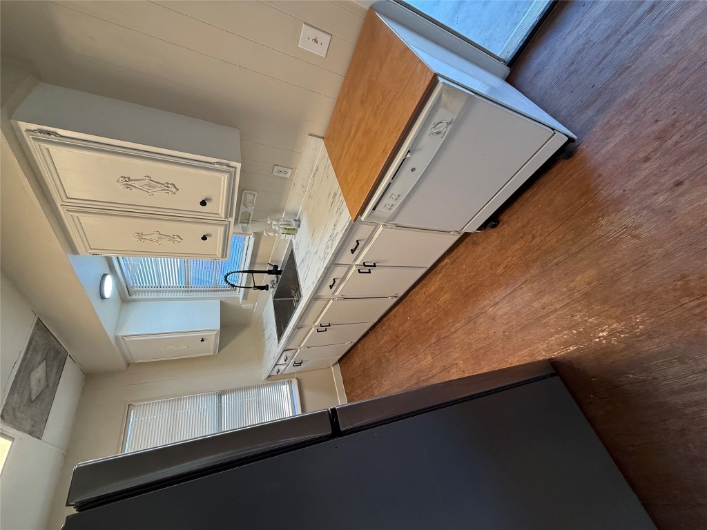 2103 Dixie Lane Round Rock, TX 78664 - Photo 6 of 8 a kitchen with stainless steel appliances granite countertop a sink stove and cabinets