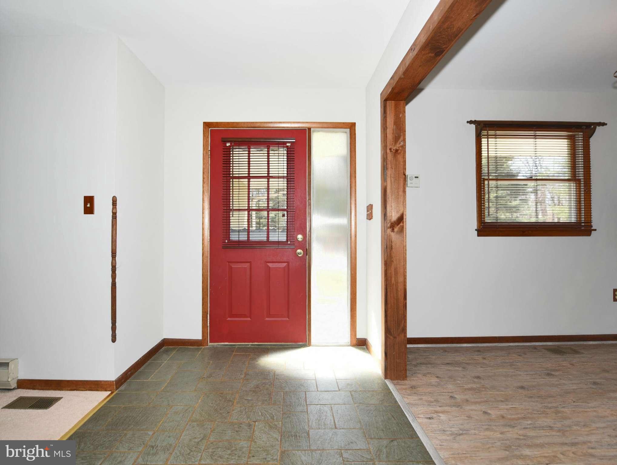 911 Ridge Road Rising Sun, MD 21911 - Photo 12 of 30 a view of an empty room with wooden floor and a window