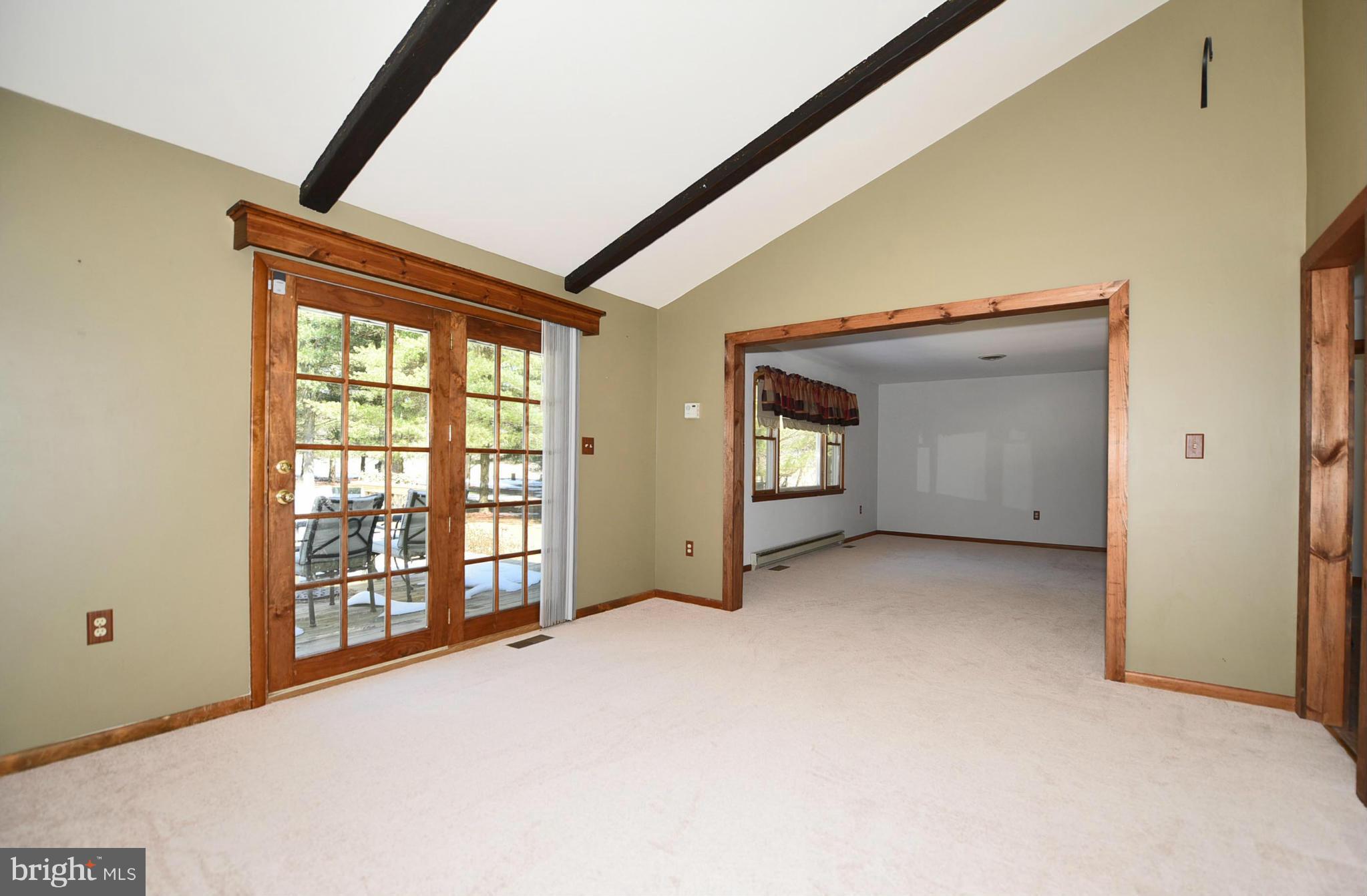 911 Ridge Road Rising Sun, MD 21911 - Photo 17 of 30 a view of an empty room with a window and balcony