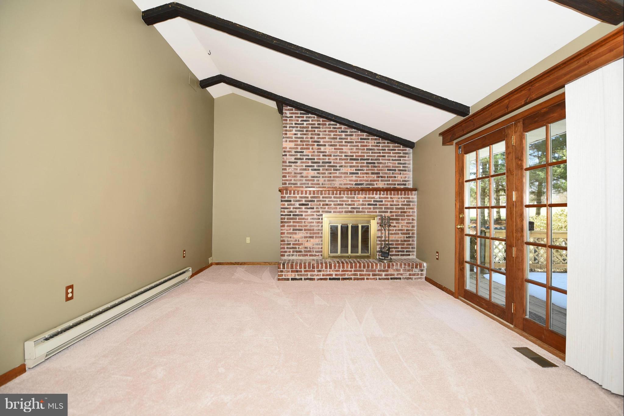 911 Ridge Road Rising Sun, MD 21911 - Photo 18 of 30 a view of an empty room with a fireplace and a window