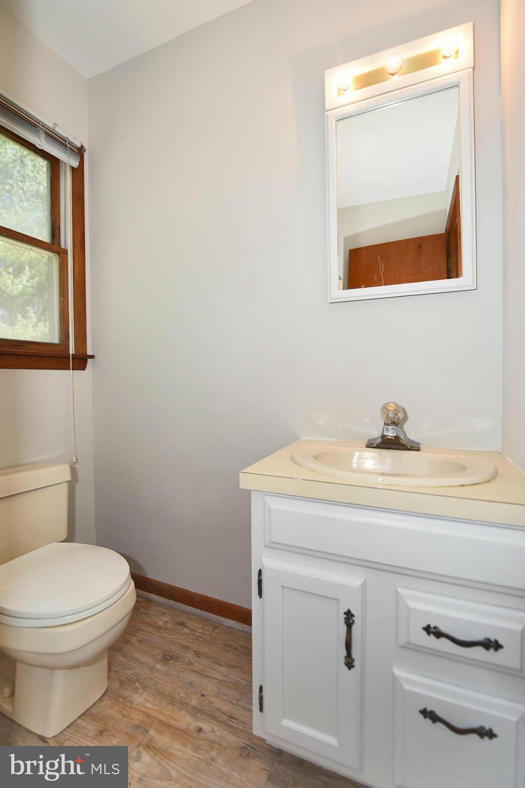 911 Ridge Road Rising Sun, MD 21911 - Photo 24 of 30 a bathroom with a toilet sink and mirror