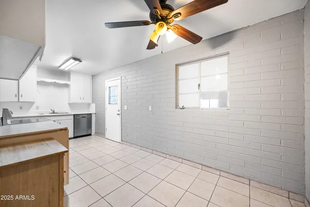 a kitchen with a stove a sink and a refrigerator