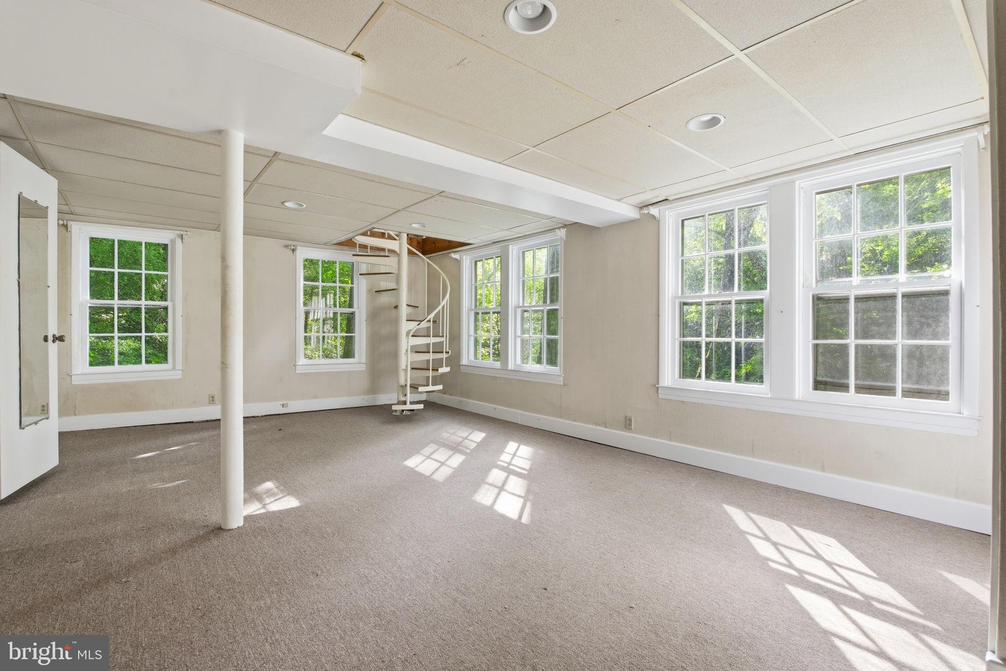 362 Severn Road Annapolis, MD 21401 - Photo 27 of 42 Bright, airy space with spiral staircase.