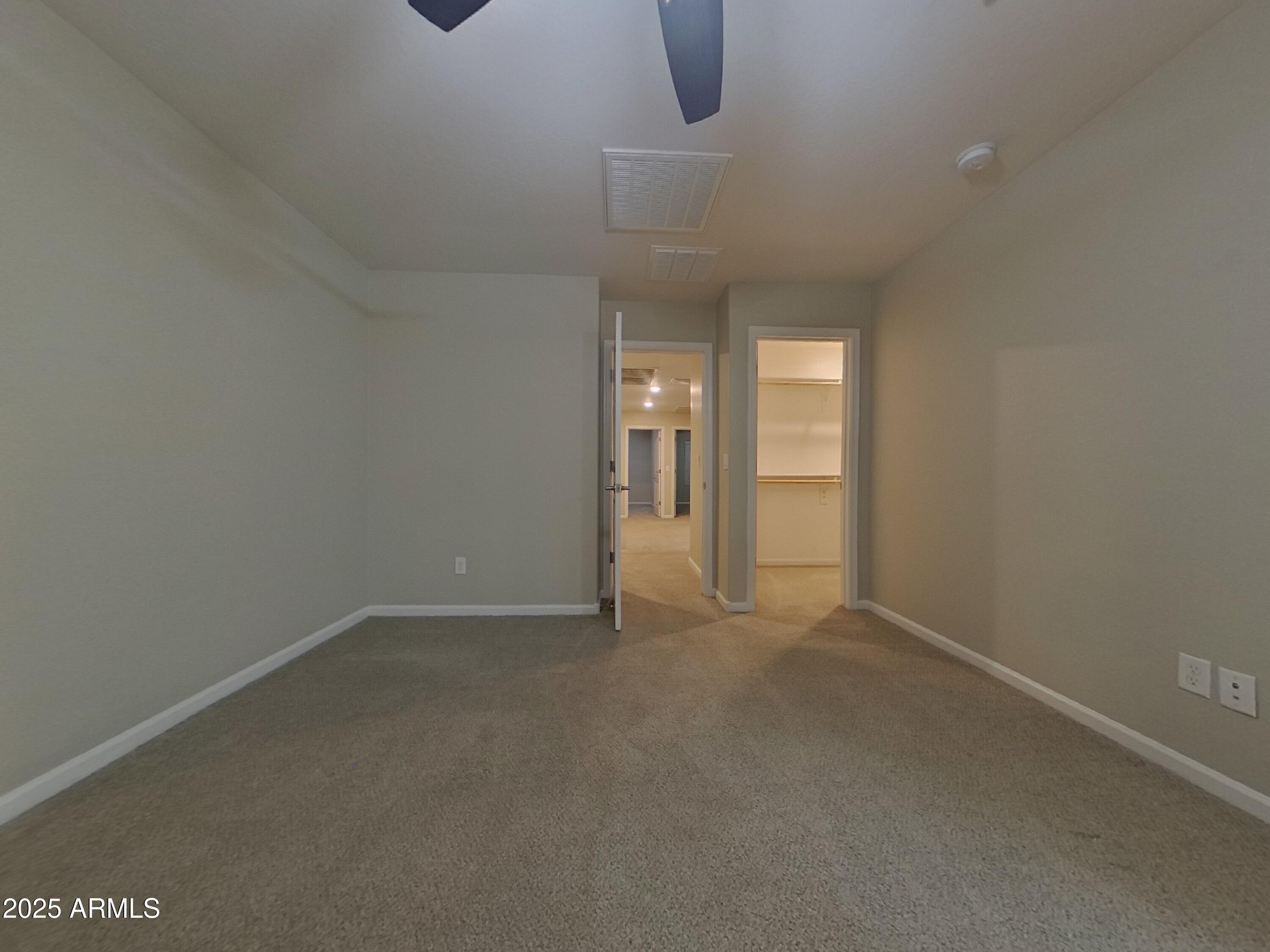 12578 West Steed Ridge Peoria, AZ 85383 - Photo 8 of 17 a view of an empty room with a window