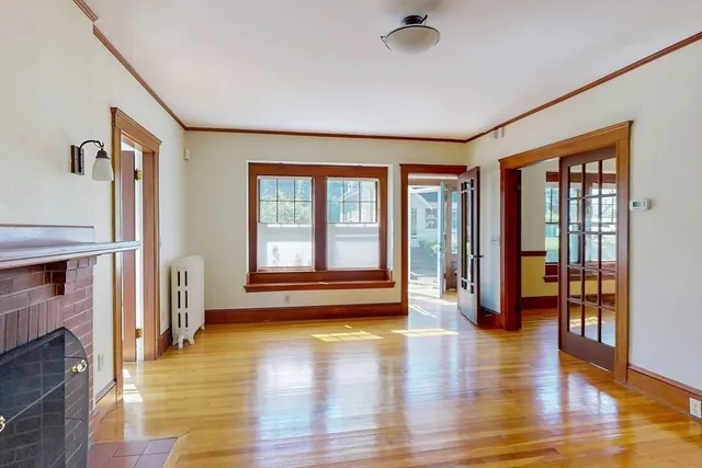 a view of an entryway with wooden floor and a window