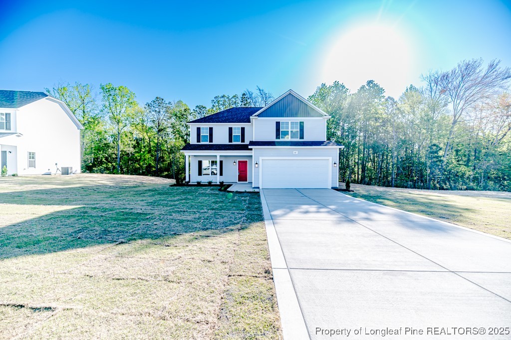 87 Onslow Court Spring Lake, NC 28390 - Photo 2 of 33 a front view of a house with a yard