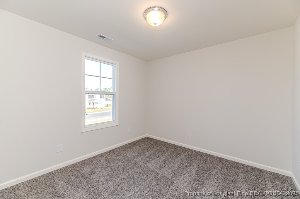 87 Onslow Court Spring Lake, NC 28390 - Photo 26 of 33 an empty room with a window
