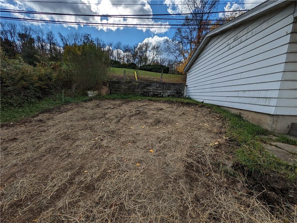 425 Huntingdon Road Yukon, PA 15698 - Photo 3 of 5 a view of a backyard