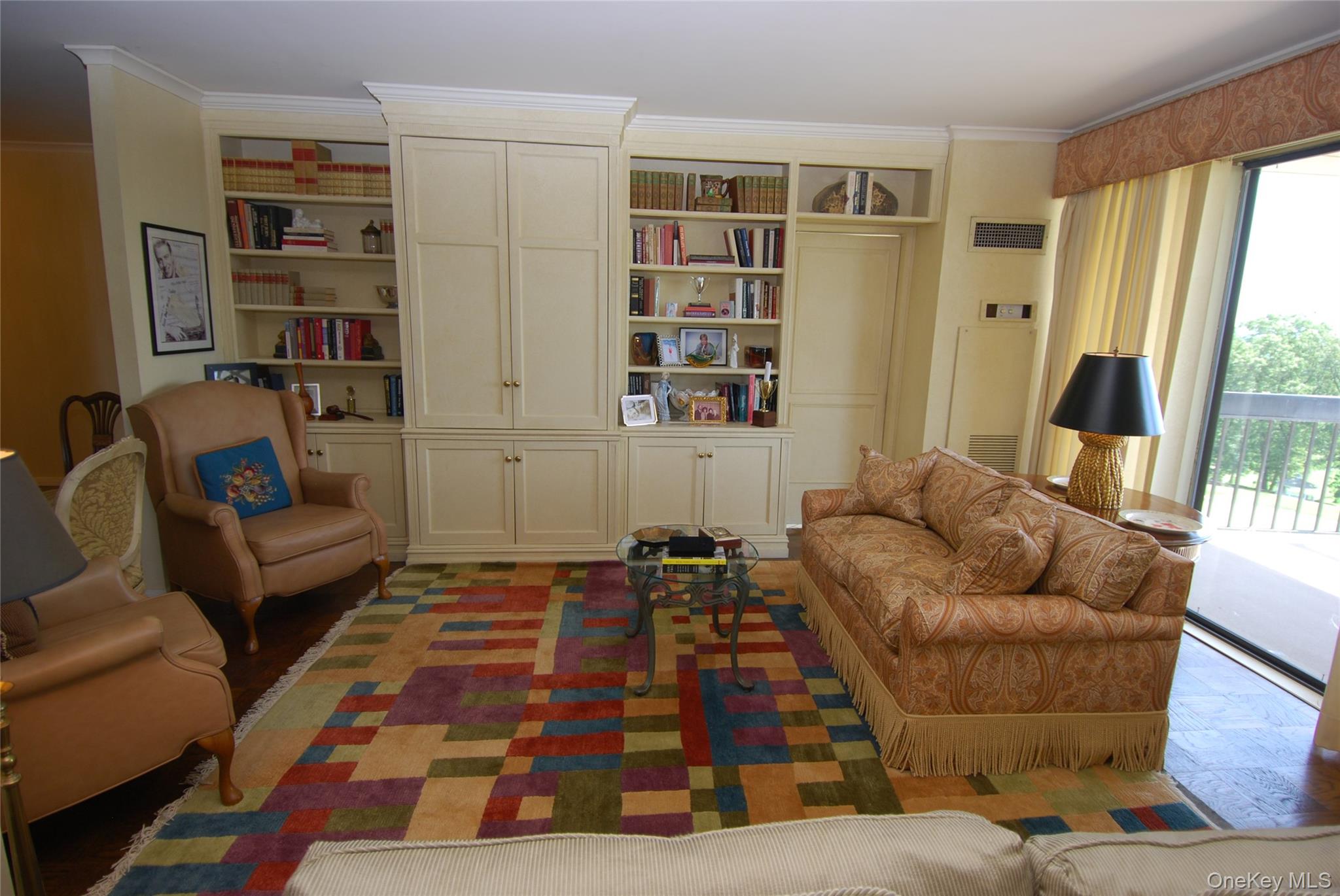 269 Grand Central Parkway, Unit 5V Queens, NY 11005 - Photo 11 of 19 a living room with furniture and a rug