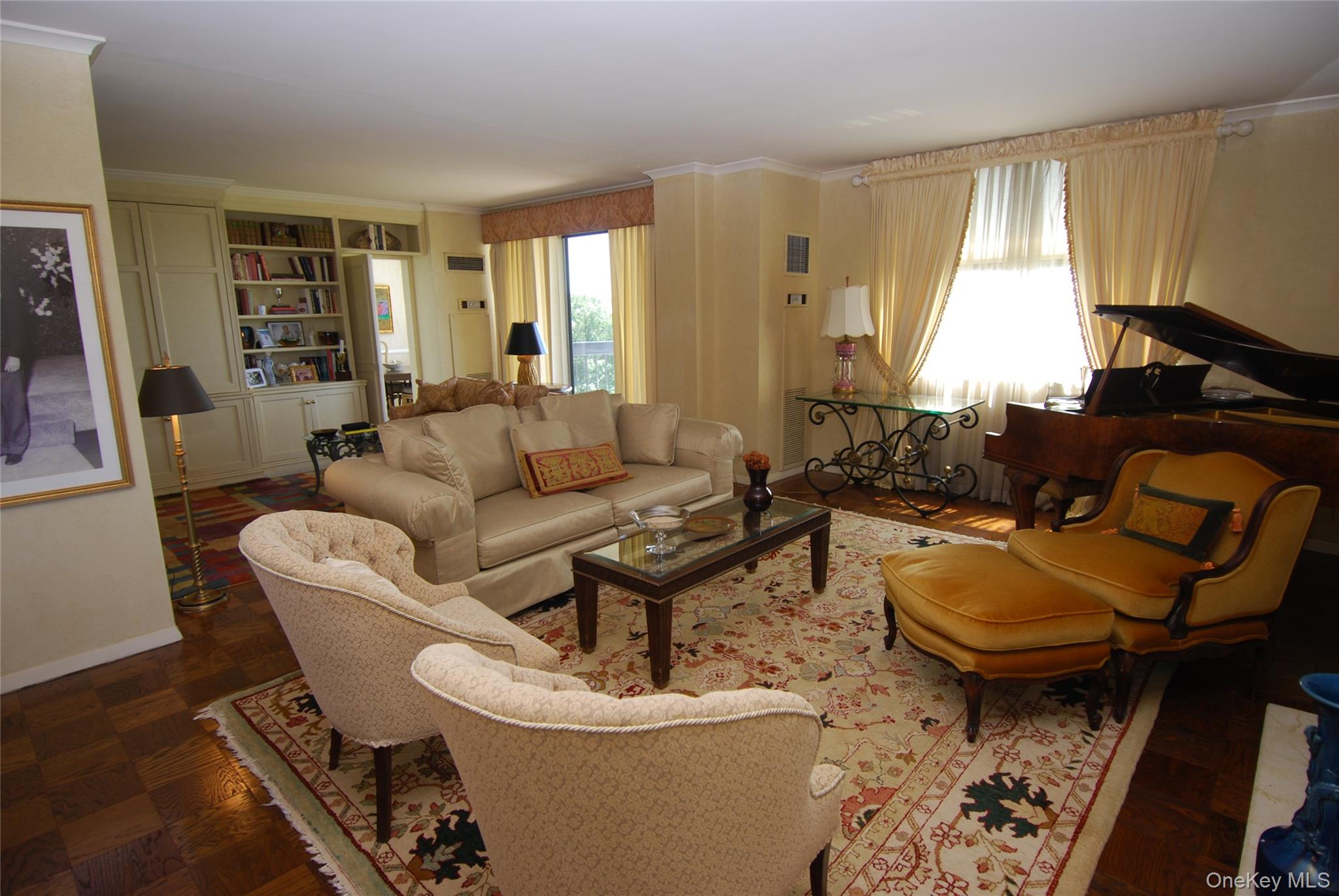 269 Grand Central Parkway, Unit 5V Queens, NY 11005 - Photo 10 of 19 a living room with furniture a rug and a window