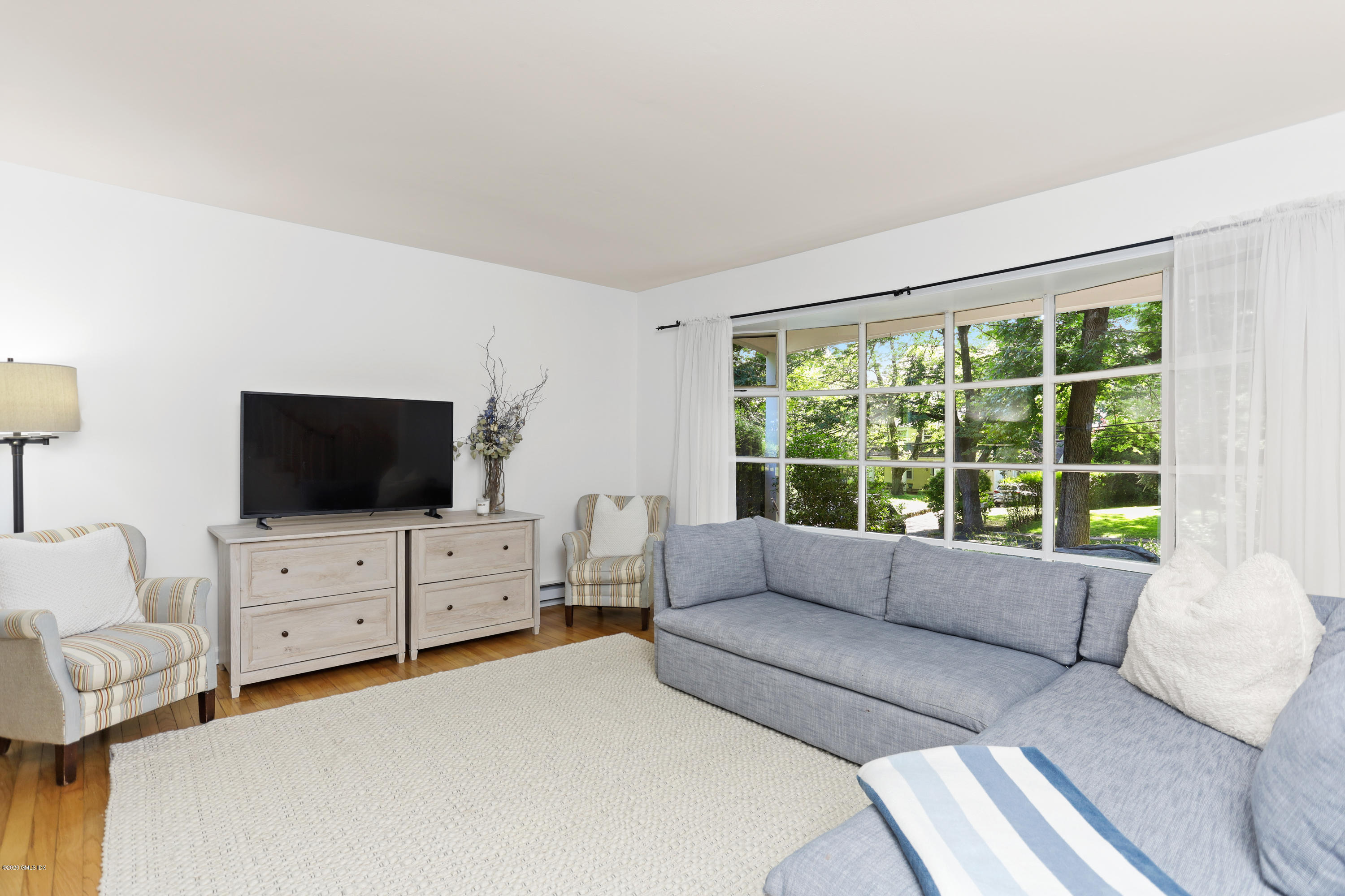 36 Butler Street Cos Cob, CT 06807 - Photo 3 of 12 a living room with furniture and a flat screen tv