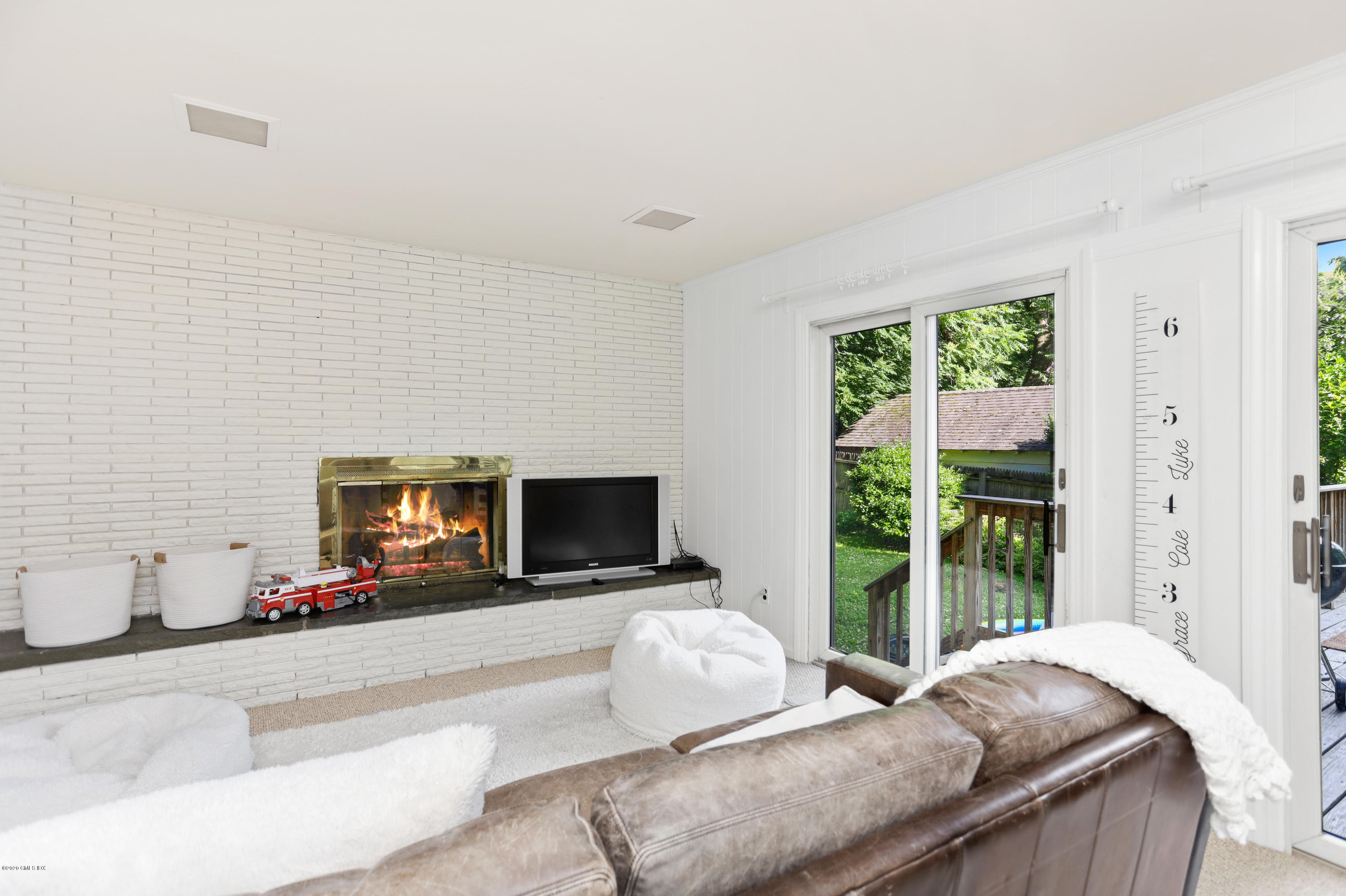 36 Butler Street Cos Cob, CT 06807 - Photo 5 of 12 a living room with furniture and a flat screen tv
