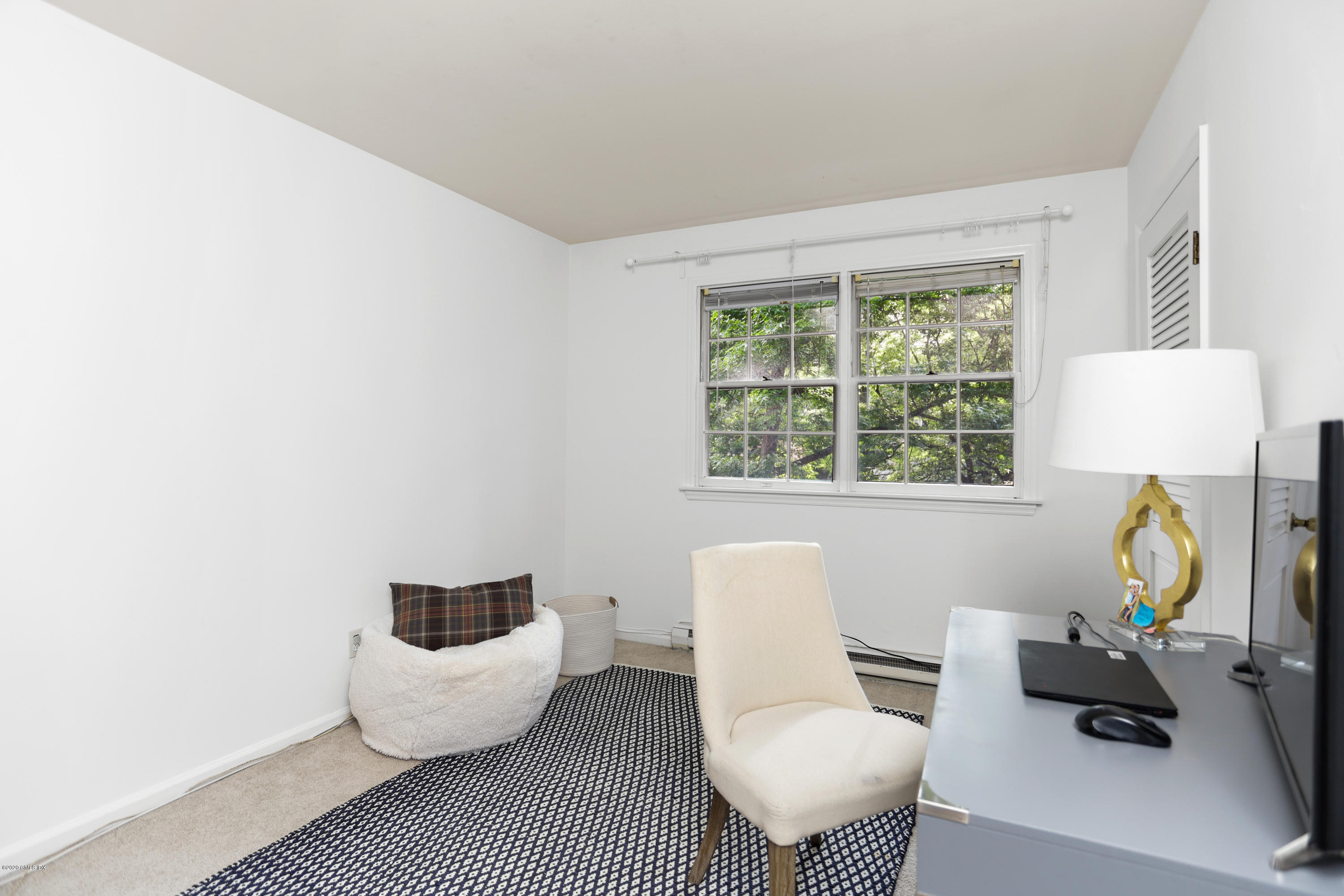 36 Butler Street Cos Cob, CT 06807 - Photo 8 of 12 a living room with furniture and a window