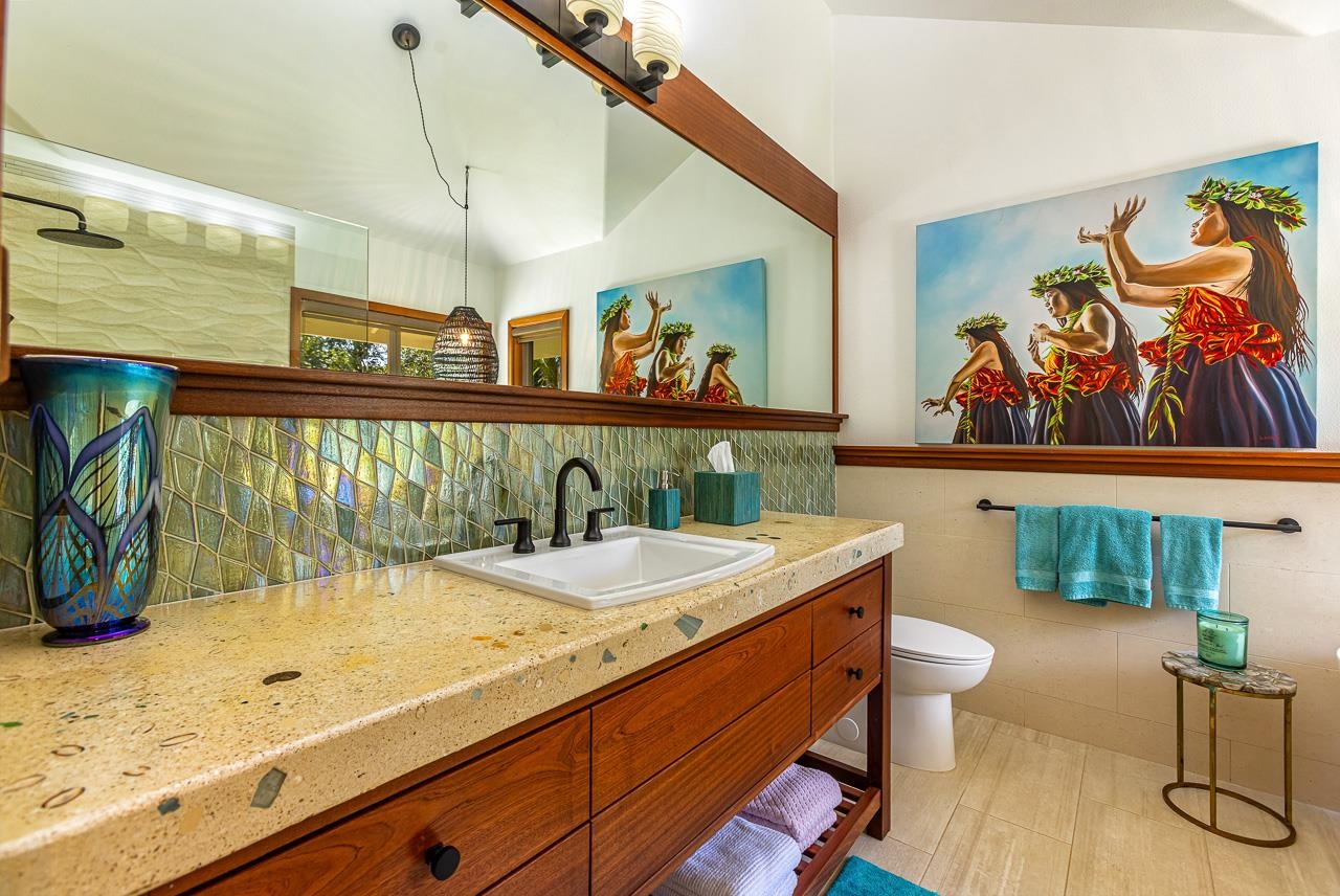 555 North Holokai Road Haiku, HI 96708 - Photo 34 of 50 The eye-catching iridescent tile in the sink's backsplash echoes the shower & the colors dance