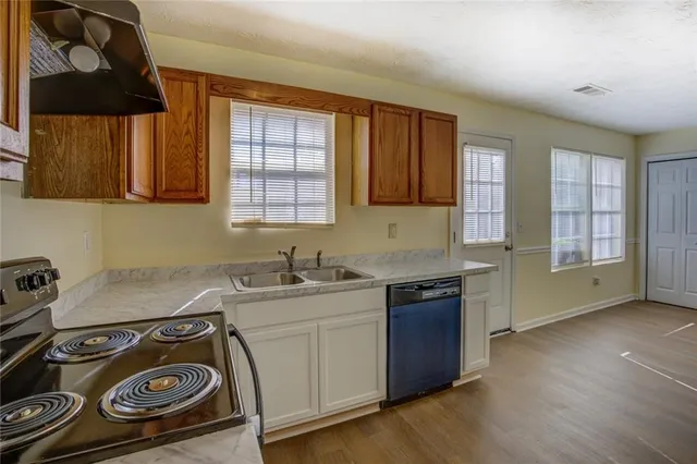 a kitchen with a stove and a sink