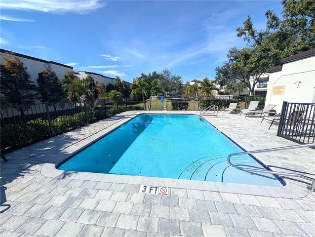a view of swimming pool with lounge chair