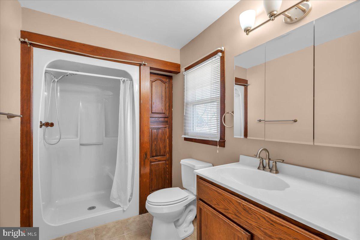 83 South Rte 73 Sicklerville, NJ 08081 - Photo 15 of 24 a bathroom with a sink a toilet and shower