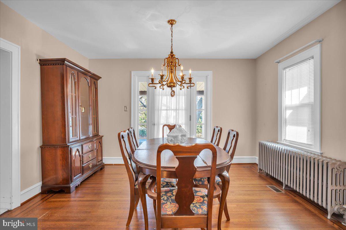 83 South Rte 73 Sicklerville, NJ 08081 - Photo 5 of 24 a dining room with furniture a chandelier and wooden floor