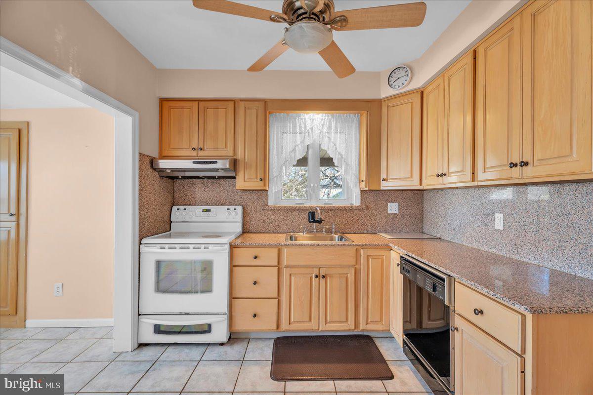 83 South Rte 73 Sicklerville, NJ 08081 - Photo 8 of 24 a kitchen with a stove cabinets and a window