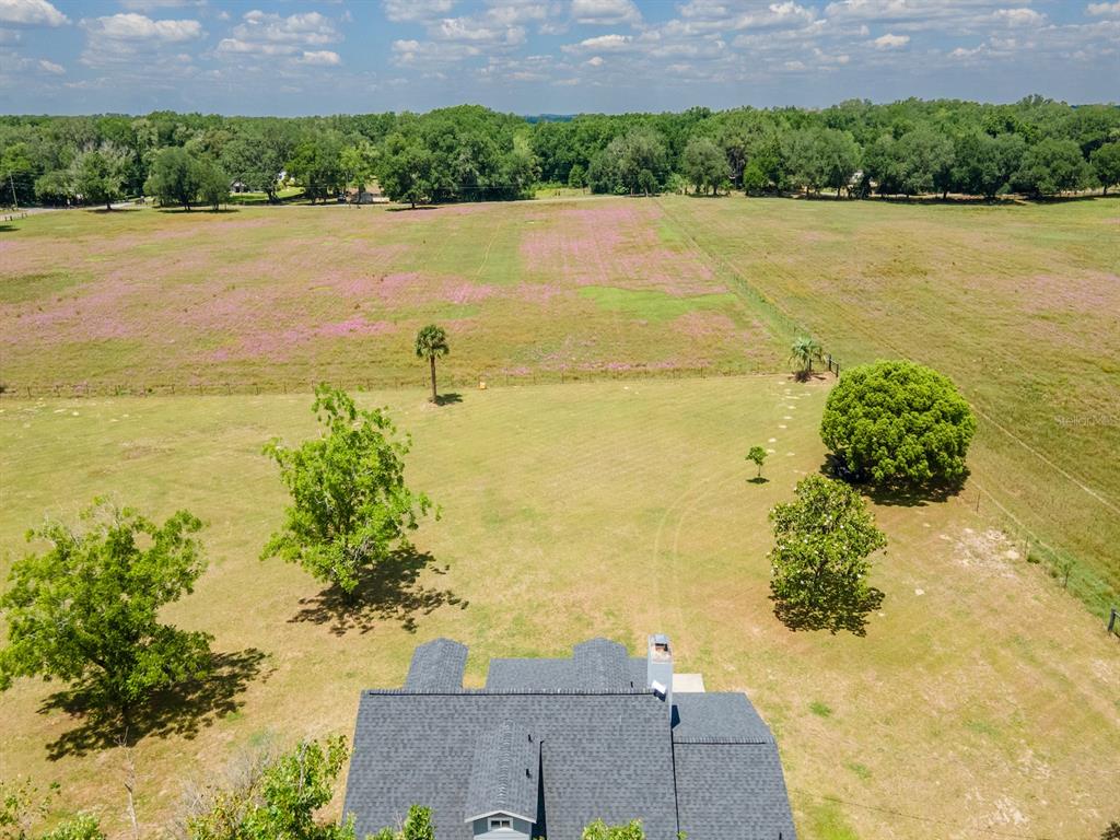 4381 Northeast 105th Place Anthony, FL 32617 - Photo 49 of 49 a view of a lake with a yard