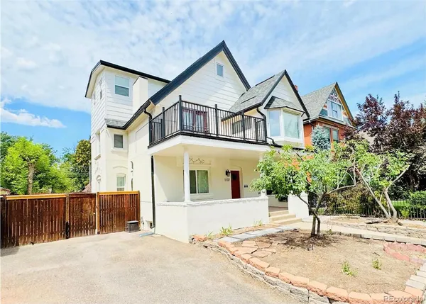 a house with trees in the background