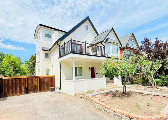 a house with trees in the background