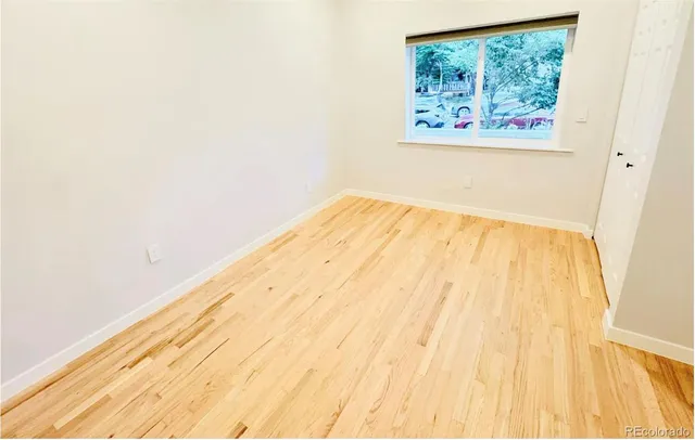 a view of living room with furniture and a window
