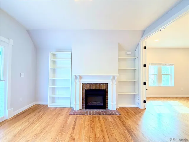 a kitchen with stainless steel appliances granite countertop wooden cabinets a stove top oven a sink and dishwasher